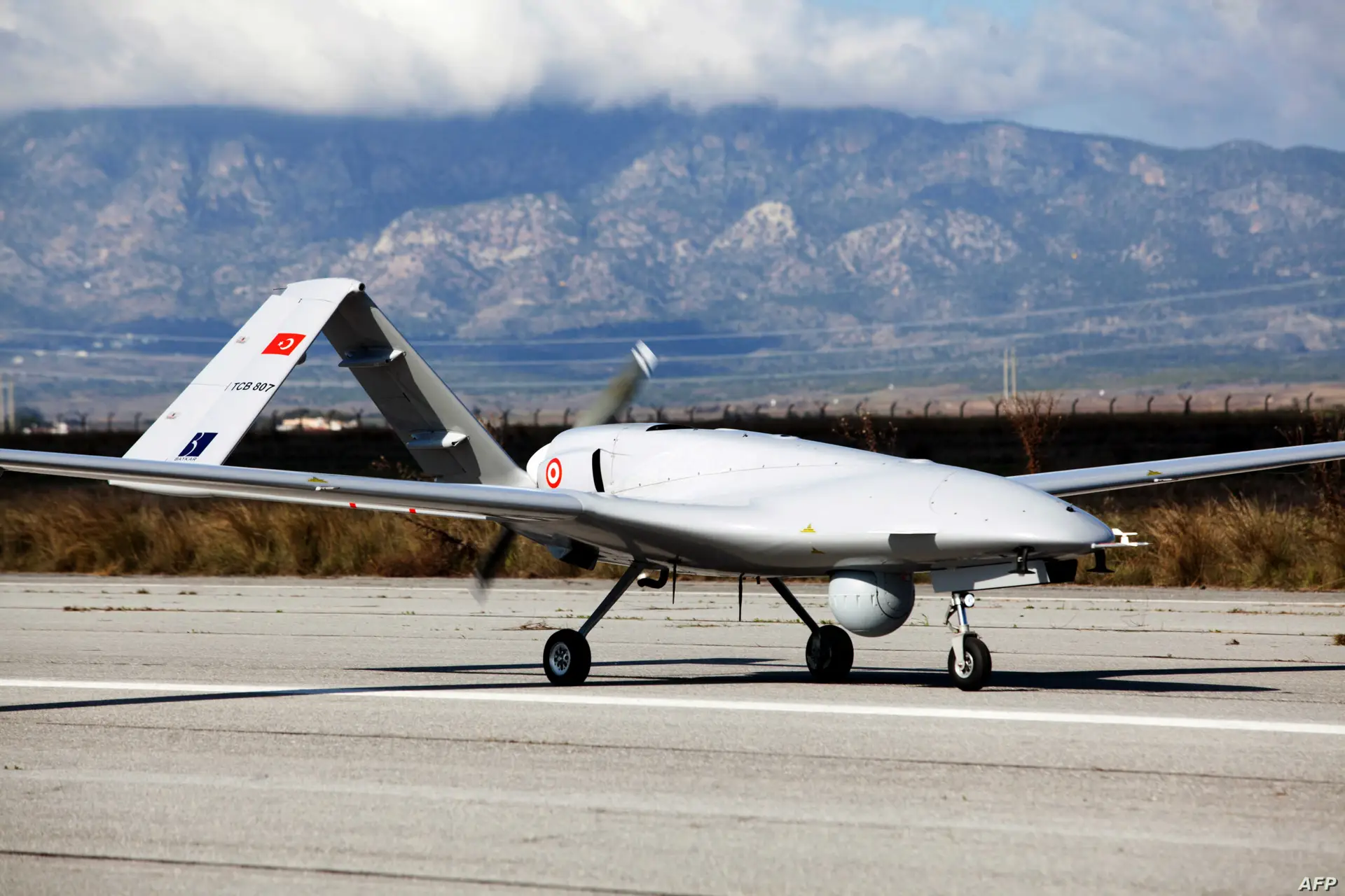 The Turkish-made Bayraktar TB2 drone is pictured on December 16, 2019 at Gecitkale military airbase near Famagusta in the self-proclaimed Turkish Republic of Northern Cyprus (TRNC). - The Turkish military drone was delivered to northern Cyprus amid growing tensions over Turkey's deal with Libya that extended its claims to the gas-rich eastern Mediterranean. The Bayraktar TB2 drone landed in Gecitkale Airport in Famagusta around 0700 GMT, an AFP correspondent said, after the breakaway northern Cyprus government approved the use of the airport for unmanned aerial vehicles. It followed a deal signed last month between Libya and Turkey that could prove crucial in the scramble for recently discovered gas reserves in the eastern Mediterranean. (Photo by Birol BEBEK / AFP)